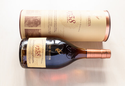 Moscow, Russia - September 25, 2021: lying box and bottle with Remy Martin 1738 Accord Royal french cognac. It named after decree issued in 1738 when King Louis XV granted Accord Royal to Remy Martin