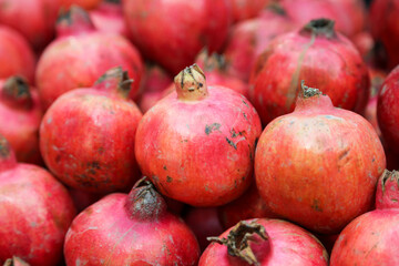 Pomegranate fruits in heap at market