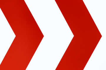Background image of white and red arrow from a work sign.