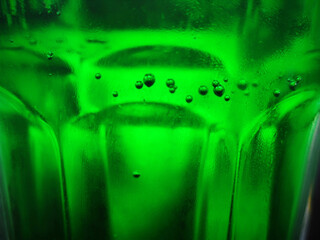 Green glass abstract background, close view