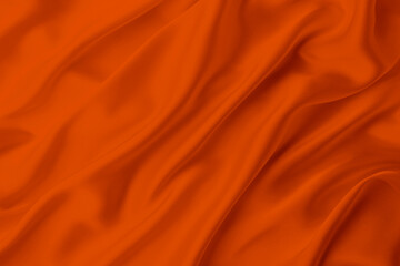 Fototapeta premium orange color satin silk with waves, abstract background luxury cloth, elegant wallpaper design.Abstract background luxury cloth or liquid wave