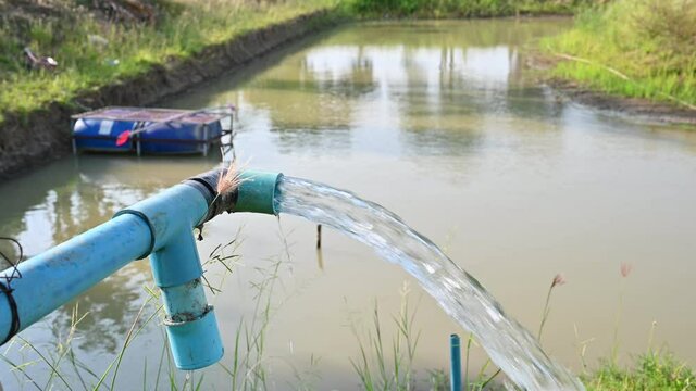 Agriculture blue pipe with groundwater gushing