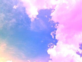 beauty sweet pastel pink orange  colorful with fluffy clouds on sky. multi color rainbow image. abstract fantasy growing lights