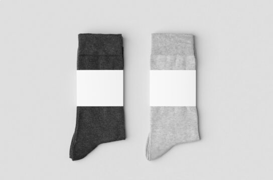 Light and dark grey socks mockup with blank label.