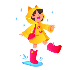 A Happy girl in a raincoat and rubber boots runs through the puddles, a happy child in the rain. Autumn walks, road from school