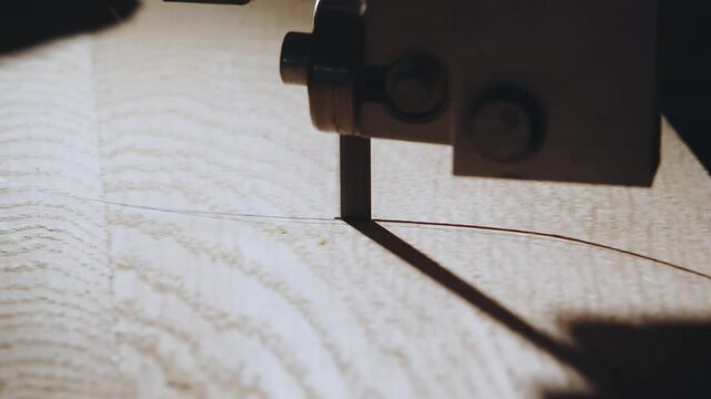 Close-up of wood carving on a machine in a carpentry workshop