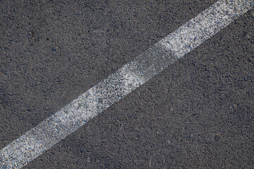 Fototapeta premium Aerial top view abstract texture and background of car tire drift skid mark on road race track, Black tire mark on street race track, Automobile and automotive concept.