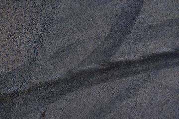 Aerial top view abstract texture and background of car tire drift skid mark on road race track, Black tire mark on street race track, Automobile and automotive concept.