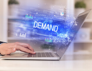 Closeup of businessman hands working on laptop