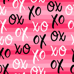 Seamless pattern of word XOXO with pink stripes background for valentine's day.