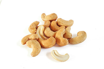 Pile of natural Roasted cashew nuts isolated on white background with clipping path