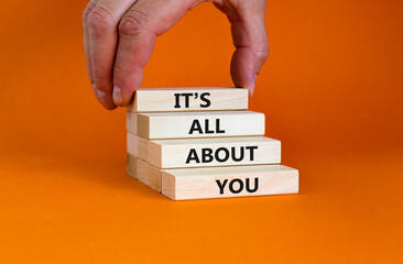 It is all about you symbol. Wooden blocks with words 'It is all about you'. Beautiful orange...