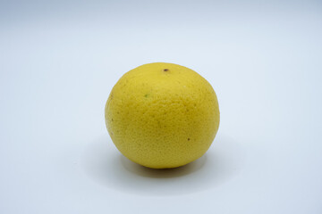 Yellow ripe lemon on a white background.