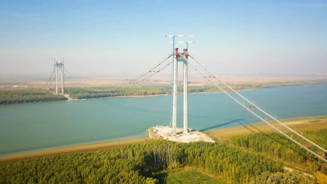 Tulcea, Romania - 20 October 2021: The construction of a new suspension bridge over the Danube, the third longest bridge in Europe