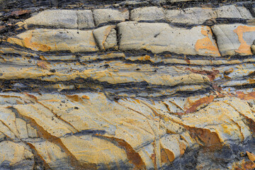 Mountain rock layers formations over the hundreds of years. Interesting background with fascinating texture, high quality background