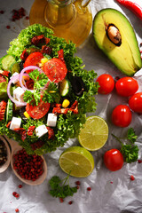 Fototapeta na wymiar Composition with vegetable salad bowl