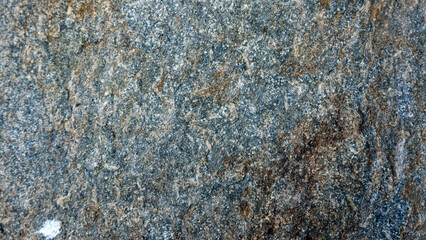 The picture is taken from a hard rock texture commonly found in mountainous areas and rivers, it can be used as material for the construction of houses, buildings and many other functions.