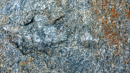 The picture is taken from a hard rock texture commonly found in mountainous areas and rivers, it can be used as material for the construction of houses, buildings and many other functions.