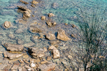 Coastal rocks in the ocean water . Pacific Ocean coast with big rocks in the water 