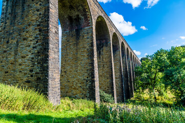 A view along the side of the Thornton viaduct next to the town of Thornton, Yorkshire, UK in...