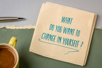 What do you want to change in yourself ? Handwriting on a napkin with coffee. Self improvement and...