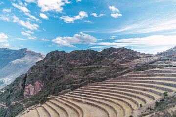 sunset in the archaeological center of Pisac located in the Sacred Valley of the Incas in Peru surrounded by terraces and platforms made by the Incas - obrazy, fototapety, plakaty