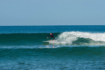 senior surfer in action in the waves