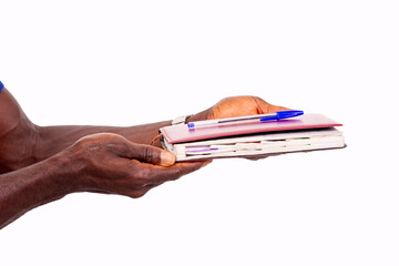 hands of a businessman showing pen and diary.