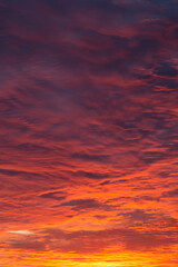 Epic Dramatic bright sunrise, sunset orange red pink sky with beautiful clouds in sunlight background texture