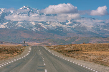 road mountains asphalt snow autumn clouds