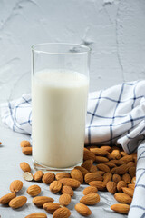 Glass of almond milk with almond nuts