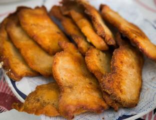 Detail of breaded pork, fried in healthy oil.