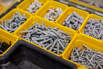 Storage case with screws, nuts, bolts, nails and other small tools for handyman, close up