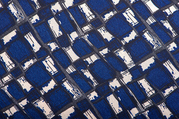 Texture background pattern. Silk fabric with a pattern of blue ,white and black squares ,100% polyester pattern