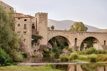 Fototapeta na wymiar Medieval town on the banks of river. Besalu, Catalonia