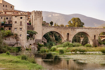 Fototapeta na wymiar Medieval town on the banks of river. Besalu, Catalonia