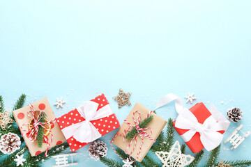 Gift boxes with ornaments on blue background