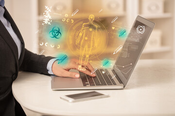 Doctor working on laptop with healthcare concept