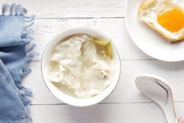 Dumpling Soup in a bowl on table,