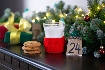 Christmas concept with milk and cookies for Santa. Advent calendar and Christmas traditions
