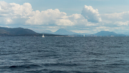 sea, boat, water, sailing, ocean, sky, sail, yacht, ship, nature, sailboat, travel, summer, cloud, clouds, landscape, coast, blue, holiday, waves, wind, horizon, mountain, mountains, seascape, tourism