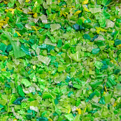 Background of plastic polymer flakes for recycling.