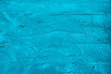 Textured wall in bright turquoise pastel color
