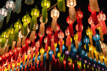 closeup beautiful hanging colorful Lanna style lighting paper lantern at night at festival in annual lantern hanging tradition in northern Thailand at Phra That Hariphunchai Temple, Lamphun 