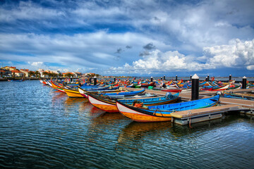 Fototapeta na wymiar Harbor with Typical Boats in the Fishing Village of Torreira, near Aveiro, Portugal