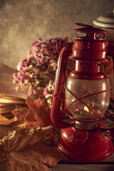 Vintage still life with an old kerosene lamp on a rustic background