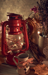 Vintage still life with an old kerosene lamp on a rustic background © Alex Shevchenko