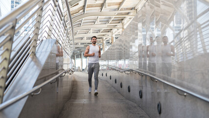 American bearded man jogging exercise in city