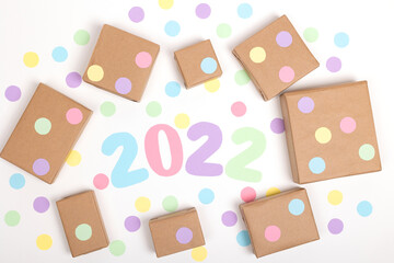 Christmas crafts paper holiday boxes on white background. Christmas winter holiday congratulation invitation birthday wedding. flat lay