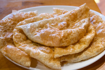 Chebureki (Çiğ börek),  a national dish of Crimean Tatar cuisine and specialty food in Eskisehir, Turkey. Close-up with selective focus